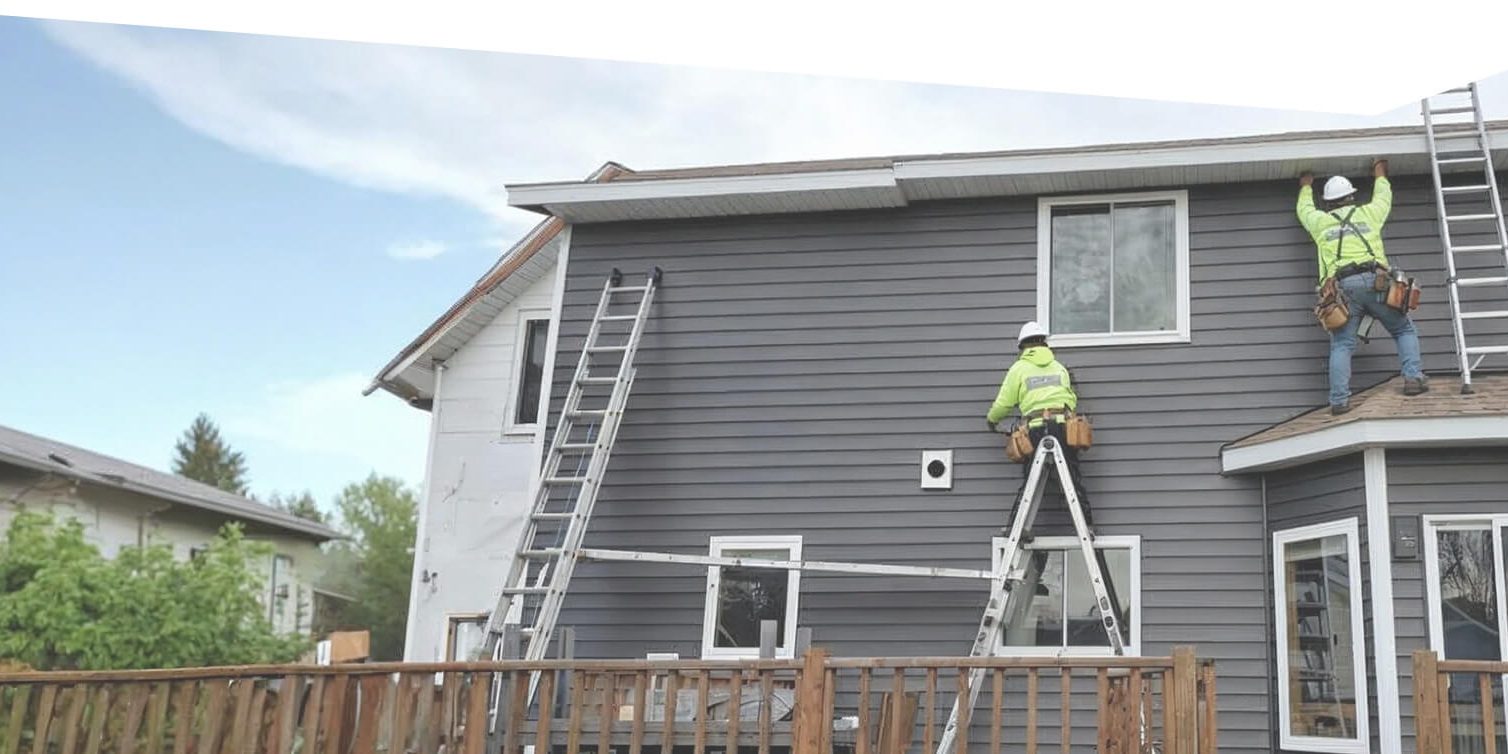Professional Siding Installation by Experienced Siding Contractor Siding contractor installing new exterior siding on a residential home using ladders and safety equipment